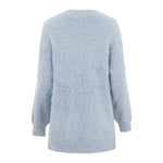 The Christy Lynn Allie Sweater in Dusty Blue is a soft, fluffy mohair sweater with long sleeves and a relaxed fit. The back of the sweater showcases a seamless design and a subtle, cozy appearance reminiscent of the Marfa Top.