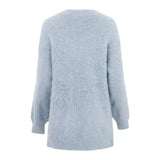 The Christy Lynn Allie Sweater in Dusty Blue is a soft, fluffy mohair sweater with long sleeves and a relaxed fit. The back of the sweater showcases a seamless design and a subtle, cozy appearance reminiscent of the Marfa Top.